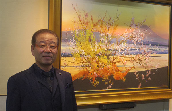 新地 哲己 会長