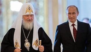 プーチン大統領とモスクワ総主教キリル一世（AFP）